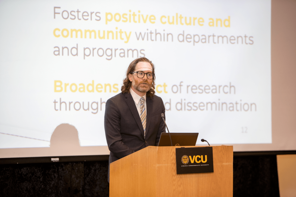 Timothy Luckritz Marquis presenting at a podium at VCU>